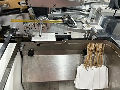 Stringing, knotting, and collection section