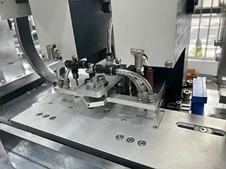 Hole punching and eyelet insertion unit